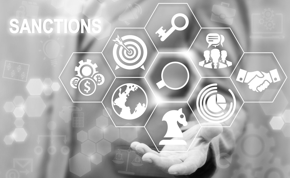 Sanctions Business concept. Businessman offer magnifier icon on virtual sanction screen. political and economic measures of deterrence countries. Embargo government